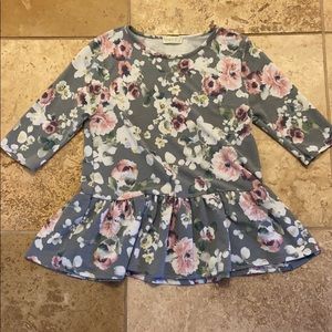 Floral half sleeve blouse.